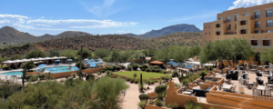 00venue view with pool and patio and mountains