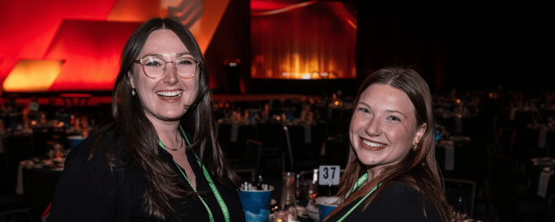 2 gogather workers setting up a conference awards dinner