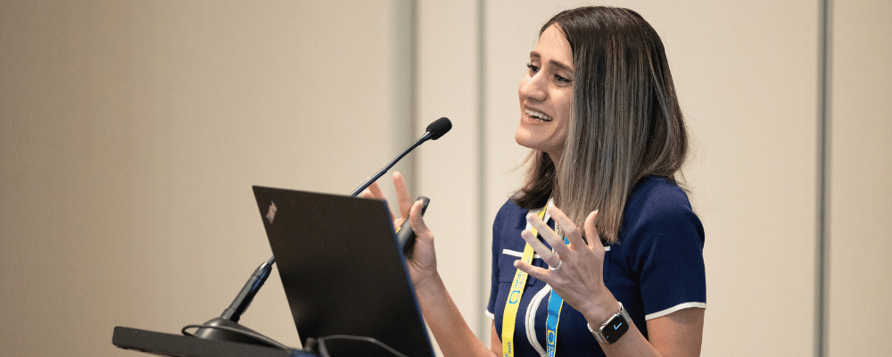 woman giving a presentation during an educational summit