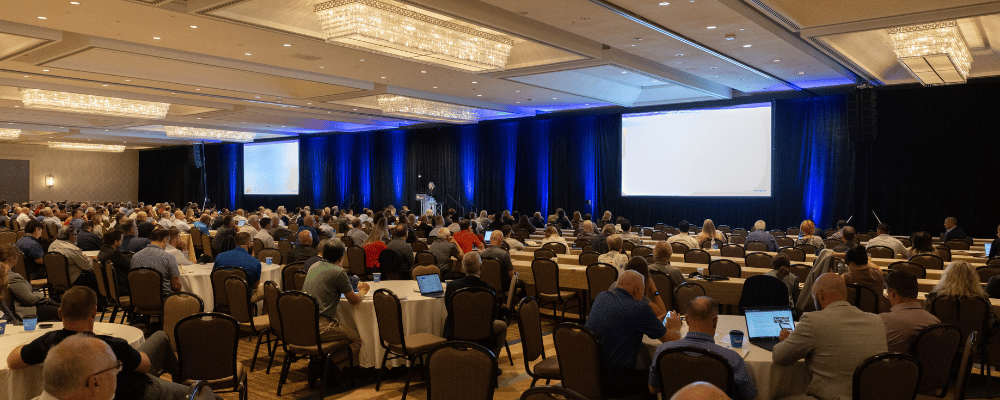 conference stage during a corporate event with attendees