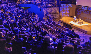 group of attendees watching a corporate conference