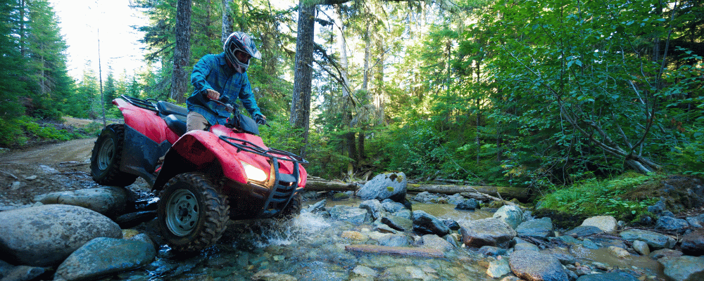 man riding an ATV at an incentive trip