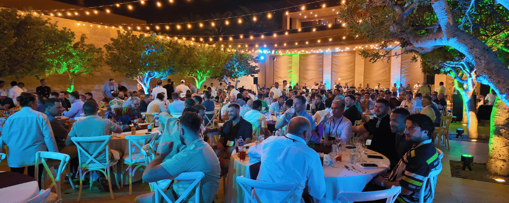 group of attendees having dinner at a cabo sales kickoff event