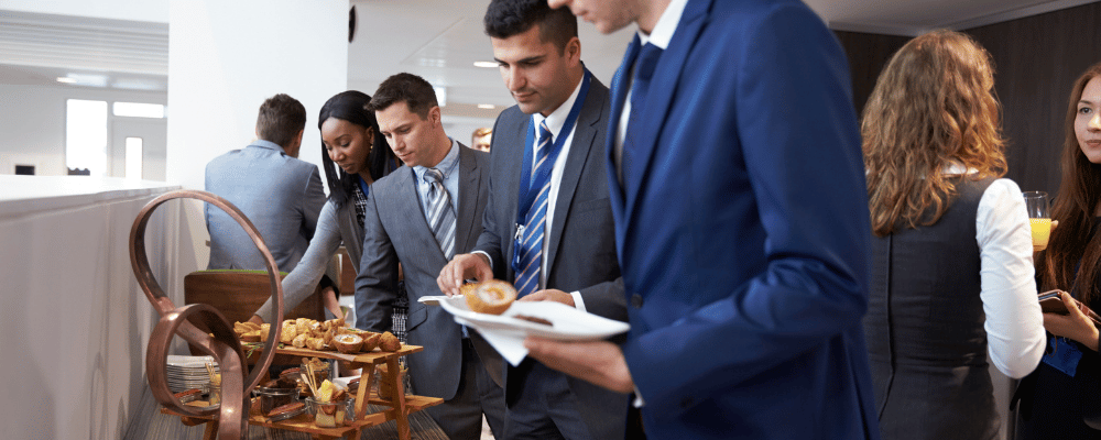 group of event attendees getting lunch at a buffet