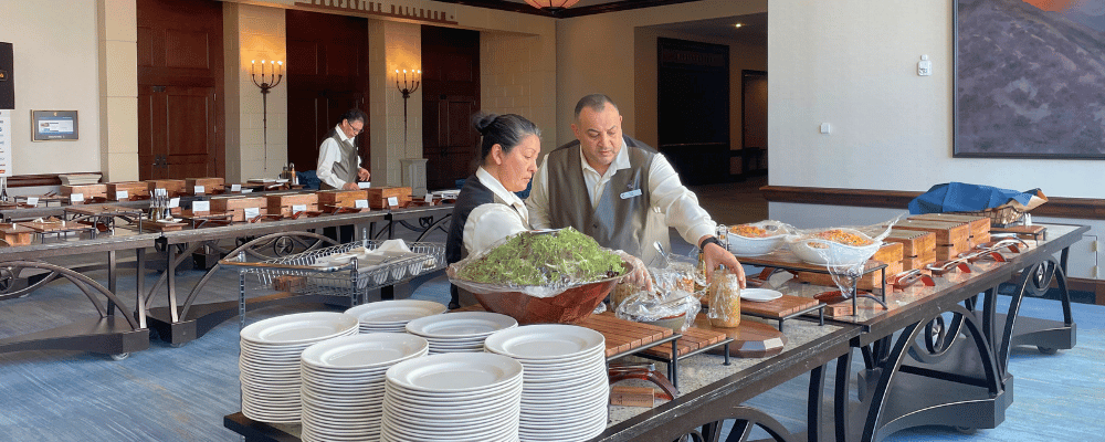 event staff setting up lunch for a corporate event