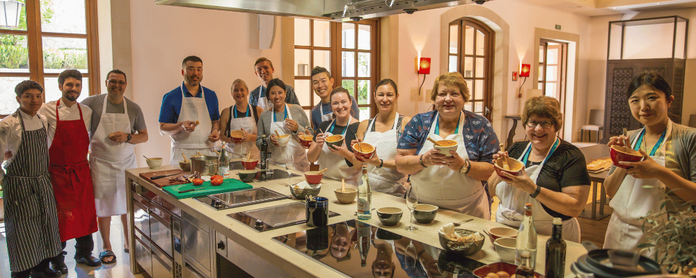 group of event attendees taking a cooking class during an incentive trip