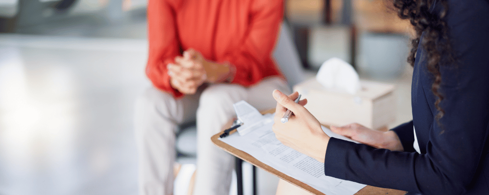 woman helping a person with translating documents 