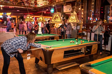 Woman playing pool