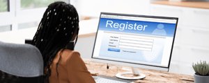 woman registering online for a corporate event