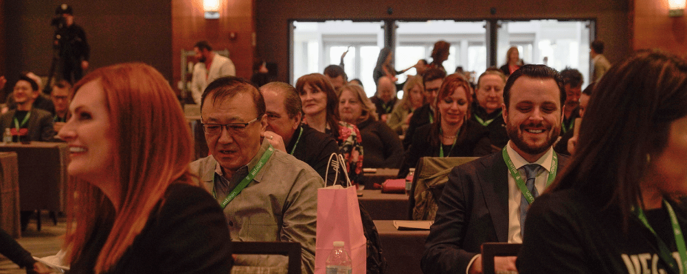 group of attendees listening to a event presentation