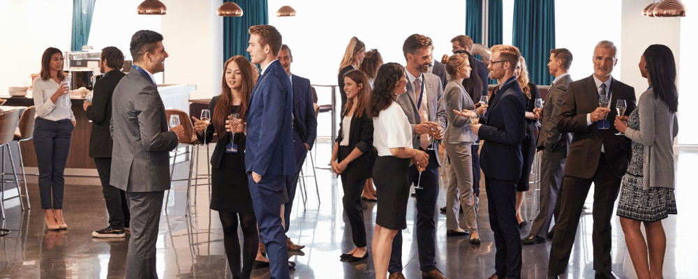 group of attendees networking at a corporate event