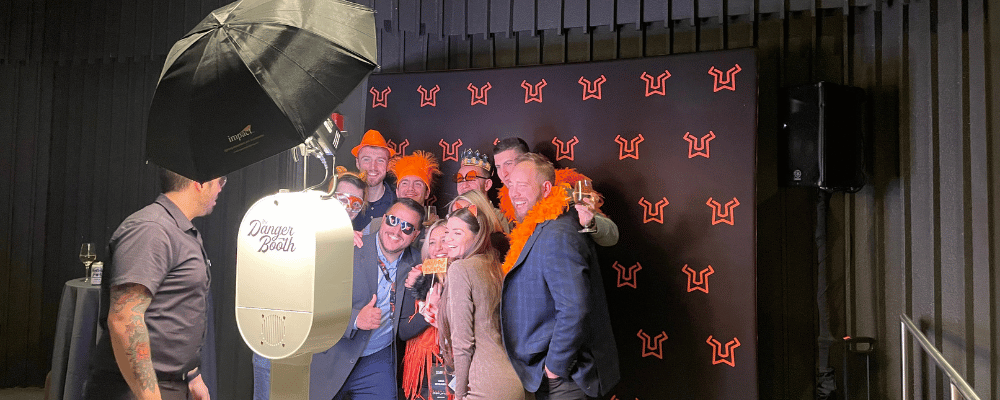 group of event attendees smiling for a photo during a conference