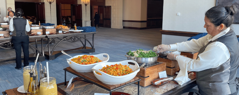 venue staff preparing corporate event lunch buffet