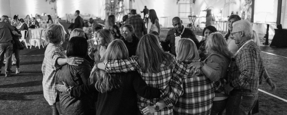 group of event attendees dancing at a corporate event