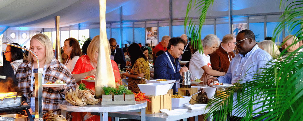 group of event attendees at the lunch buffet at a corporate event