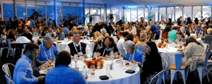 group of event attendees networking during a franchise convention