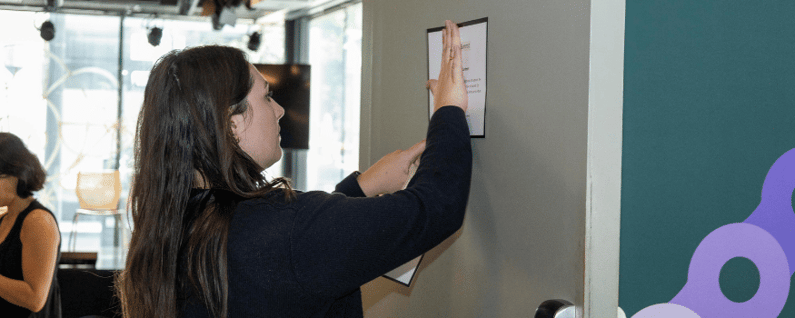 GOGather team member setting up event signs at a conference