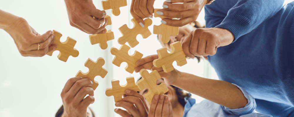 group of event attendees participating in a puzzle