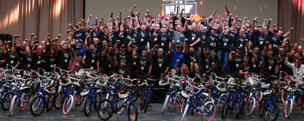 group of event attendees celebrating during a corporate conference bike competition