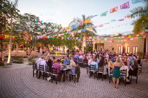 Group of attendees enjoying a dinner at a incentive group trip in mexico