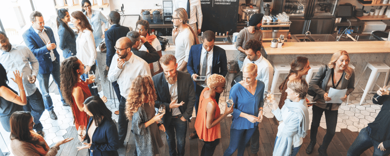 Group of attendees networking at a sales kickoff event