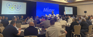group of attendees watching a presentation during. afranchise convention
