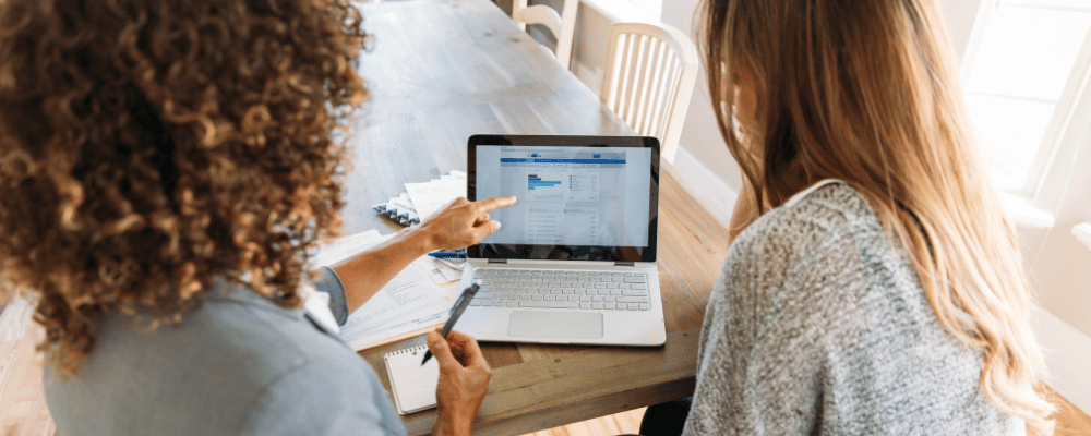 event manager helping an attendee register for an event