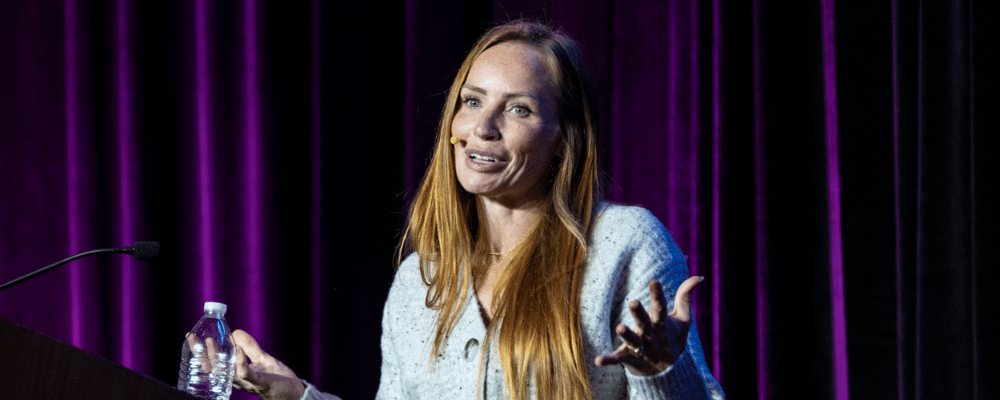 woman giving a presentation to her colleagues about corporate events