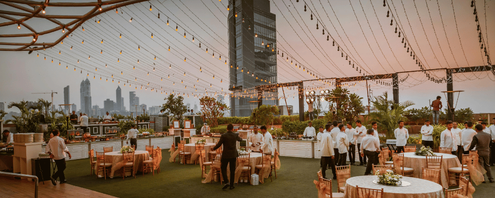 hotel rooftop conference venue with string lights