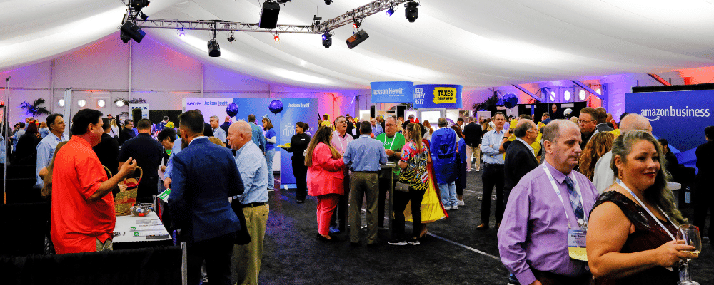 group of conference attendees networking during an expo