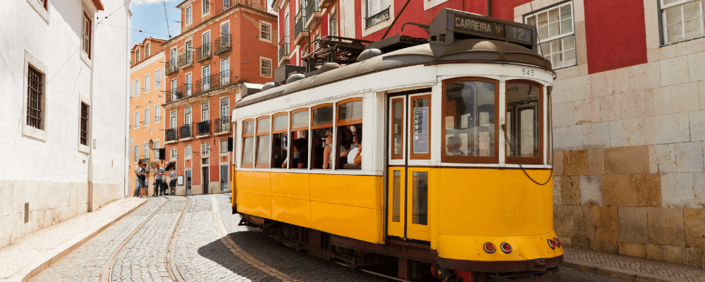 yellow trolly car in lisbon, portugal