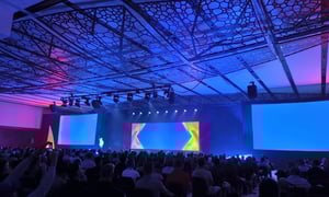 group of attendees watching a conference