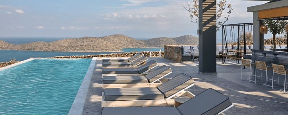 pool view at the Domes Aulus Elounda All Inclusive Resort, Curio Collection by Hilton, Crete, Greece