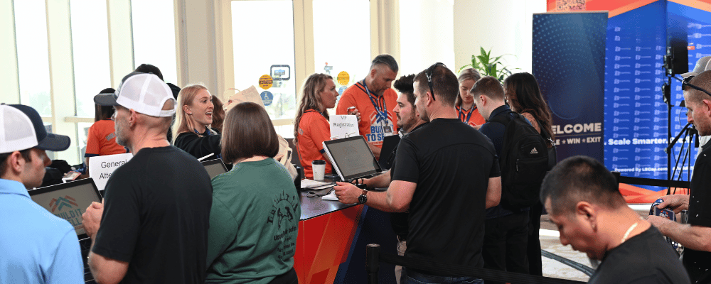 attendees checking in at a conference