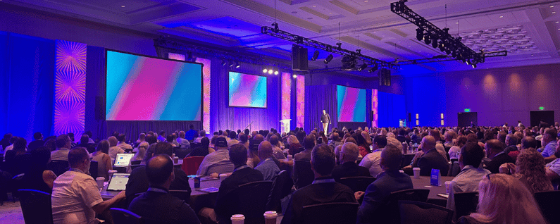group of attendees watching a conference