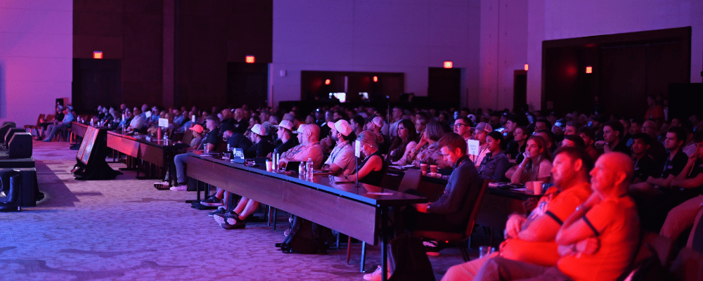 group of attendees watching a conference