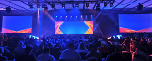group of attendees watching a corporate event
