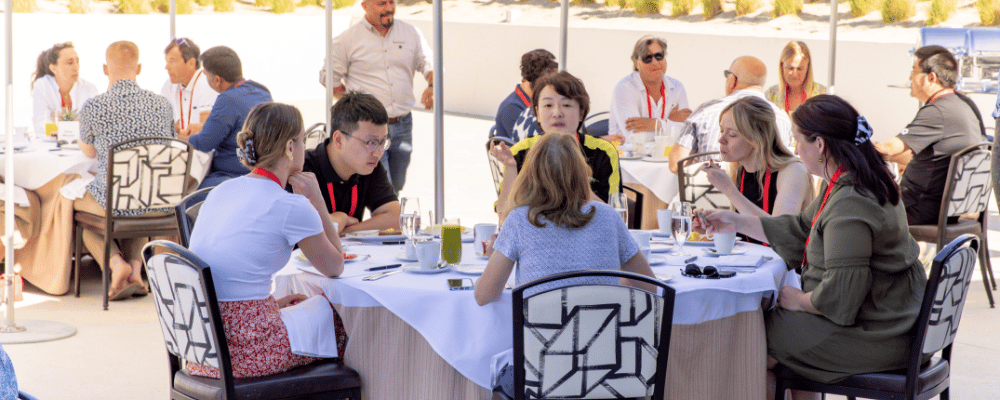 conference attendees networking during breakfast