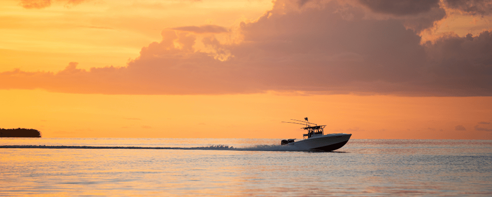 boat on the Florida Keys water with the sunset