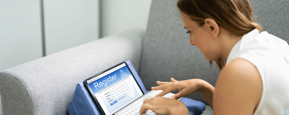 woman registering for an event on her computer