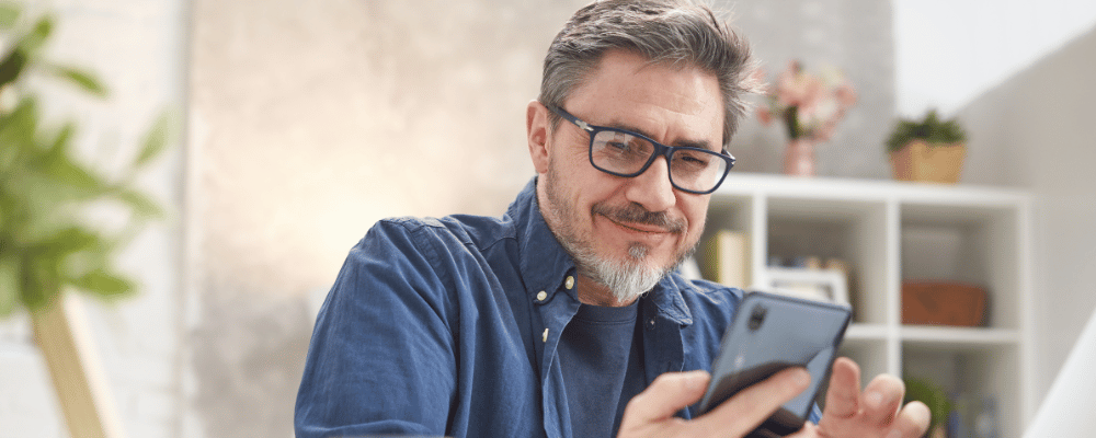 man registering for an event on his iphone