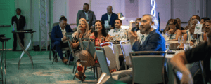 group of attendees clapping during an awards dinner