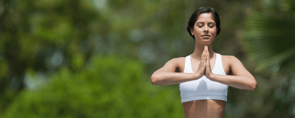 Woman praying in yoga in Bali, Indonesia