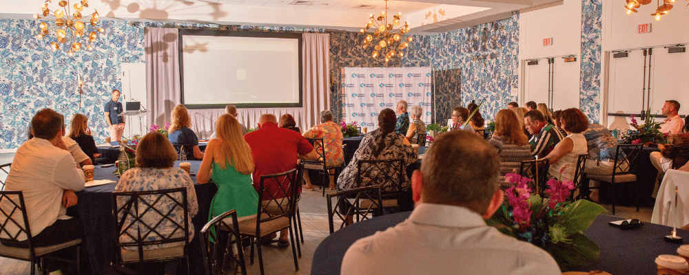 group of event attendees watching an incentive trip presentation