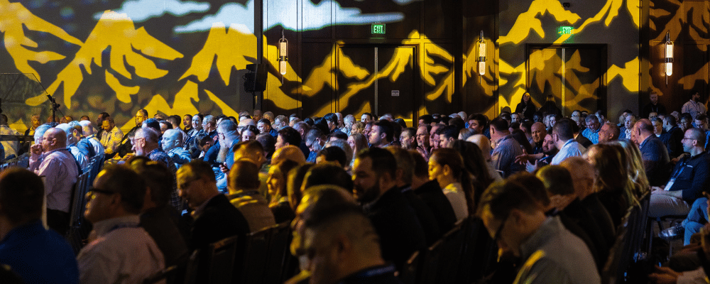 group of attendees watching a conference