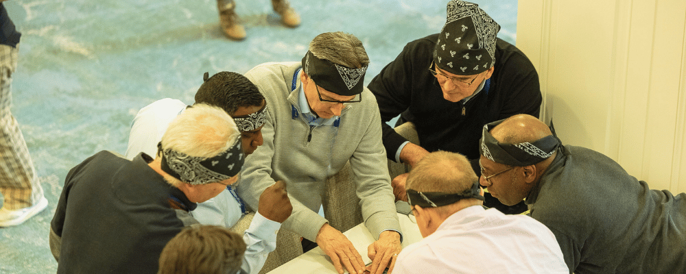 group of attendees playing a puzzle game