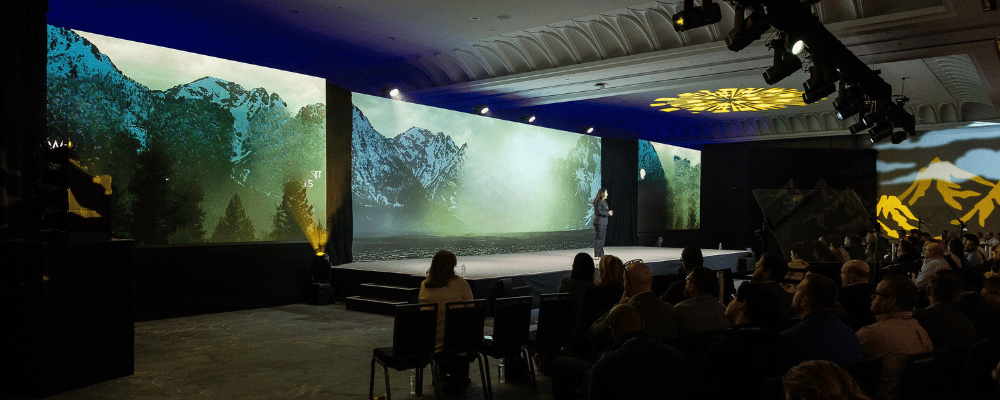 group of attendees watching a conference