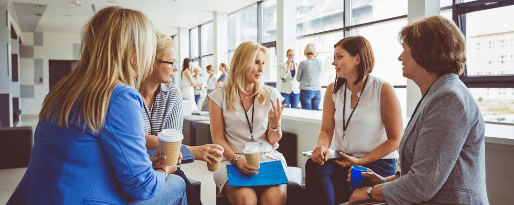 group of attendees talking during a breakout sesion