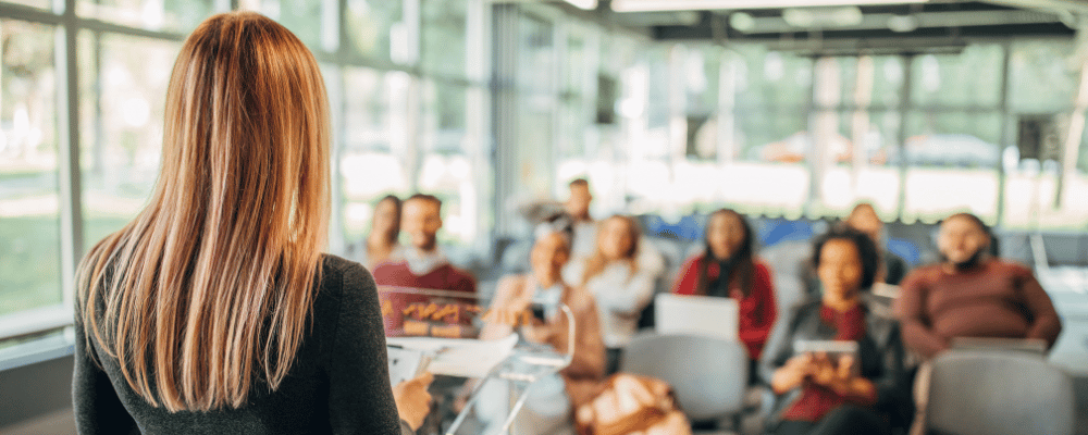 Woman giving presentation to small group in a breakout room