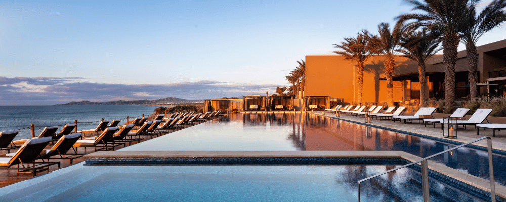 pool overlooking the beach in cabo
